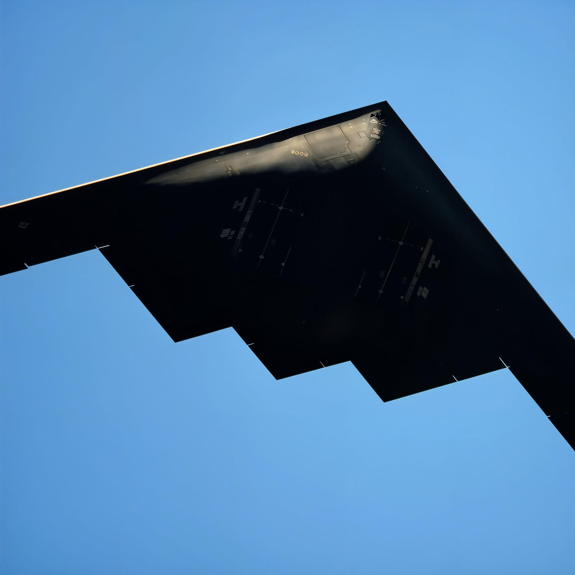 Stealth aircraft from below symbolizing precision engineering